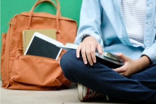 Back of student with backpack